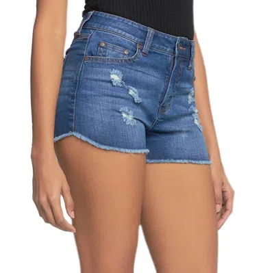 Elan Distressed Mid Rise Short In Denim In Blue
