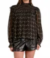 Elan Long Sleeve Mock Tie Neck Top In Black Geo Print In Brown