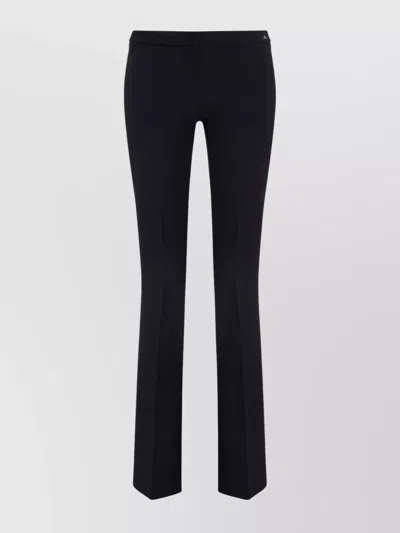 ELISABETTA FRANCHI FLARED TROUSERS WITH BUTTON DETAIL AND RIBBED TEXTURE