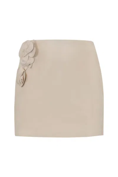 ELISABETTA FRANCHI LEATHER SKIRT WITH FLORAL APPLICATIONS