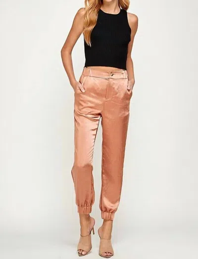 Ellison Satin Joggers In Gold In Pink