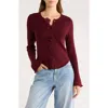 Elodie Rosette Bell Sleeve Sweater In Burgundy