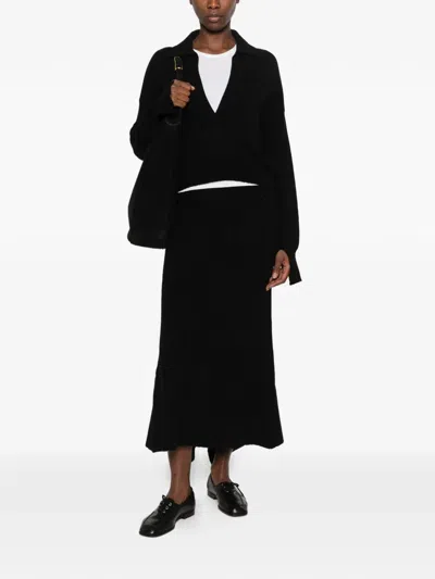 Ely Ely Haze Ribbed Asymmetric-hem Midi Skirt In Schwarz