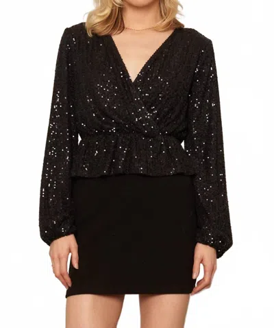 En Creme Long Sleeve Peplum Sequin Top In Black