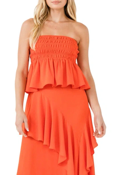 Endless Rose Smocked Strapless Peplum Top In Orange