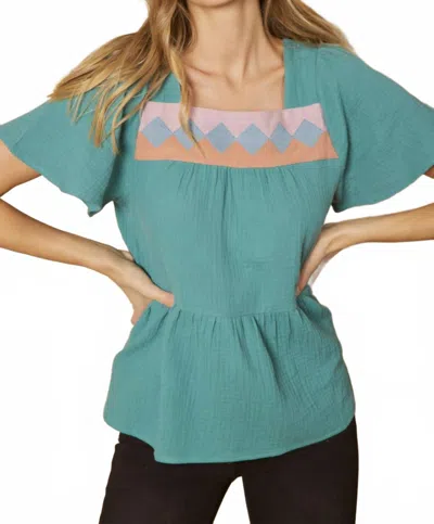 Entro Geometric Design Peplum Top In Forest In Green