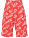 Erl Coca-cola Straight-leg Distressed Printed Cotton-canvas Shorts In Red