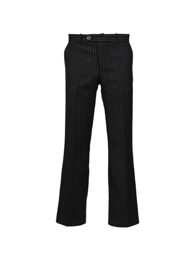 Ernest W Baker Pinstripe-pattern Flared Virgin-wool Trousers In Black