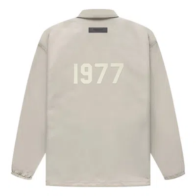 ESSENTIALS FEAR OF GOD ESSENTIALS SS22 1977 COACHES JACKET 'SMOKE'