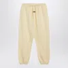 Essentials Logo Patch Track Pants In Yellow