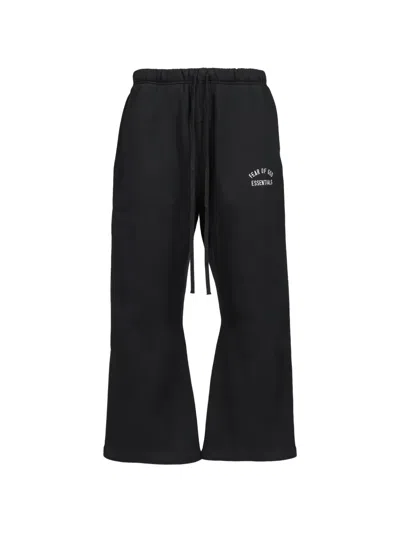Essentials Logo-print Flared Trousers In Black