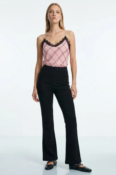 Exquise High Waisted Flared Knit Trousers In Black