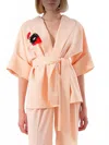 Exquise Short Sleeve Crepe Jacket In Light Peach In Pink