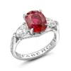 Fabergé Oval Cut Ruby And Diamond Ring In Red