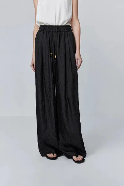 Fabrique Louise Textured Loose Boho Pants In Wrinkled Satin In Black