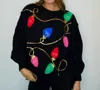 Fantastic Fawn String Of Lights Sequin Sweater In Black In Black