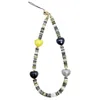 Farra Grey Black Shell With Ceramic Hearts Artistic Phone Strap