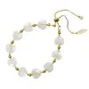 Farra Women's White Heart Shaped Moonstone Adjustable Bracelet In White