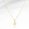 Fashnzfab -b- Stainless Steel Cz Stone Paved Initial Monogram Pendant Necklace In Gold