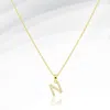 Fashnzfab -n- Stainless Steel Cz Stone Paved Initial Monogram Pendant Necklace In Gold