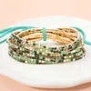 Fashnzfab 12pcs - Ribbon Colorful Rhinestone Layered Stretch Bracelets Gold, Peridot In Multi