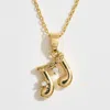 Fashnzfab 14k Gold Dipped Cz Stone Accent Musical Note Pendant Necklace In Gold