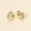 Fashnzfab 14k Gold Dipped Cz Stone Paved Mini Huggie Hoop Earrings In Gold