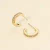 Fashnzfab 14k Gold Dipped Cz Stone Paved Mini Open Hoop Earrings In Gold