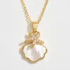 Fashnzfab 14k Gold Dipped Cz Stone Paved Starfish Mother Of Pearl Shell Pendant Necklace In Gold