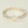 Fashnzfab 14k Gold Plated Cz Stone Clover Accent Hinged Bangle Bracelet In Gold