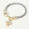 Fashnzfab 14k Gold Plated Cz Stone Paved Cross Charm Two Tone Bracelet Two Tone In Multi