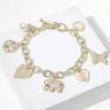Fashnzfab 14k Gold Plated Cz Stone Paved Elephant Heart Butterfly Heart Clover Pearl Charm Station Bracelet Go In Gold