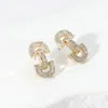 Fashnzfab 14k Gold Plated Cz Stone Paved Horsebit Earrings - Gold In Gold