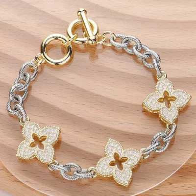 Fashnzfab 14k Gold Plated Cz Stone Paved Iris Pendant Link Toggle Bracelet In Silver