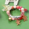 Fashnzfab 2pcs - Jingle Gingerbread Man Charm Bow Beaded Stretch Multi Layered Bracelets In Multi