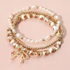 Fashnzfab 3pcs - Metal Bow Charm Pointed Ceramic Ball Pearl Beaded Stretch Multi Layered Bracelets In Multi