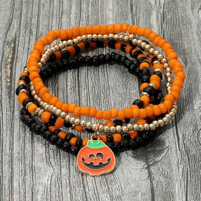 Fashnzfab 5pcs - Halloween Pumpkin Charm Accent Seed Beaded Stretch Multi Layered Bracelets