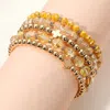 Fashnzfab 5pcs - Metal Cross Accent Faceted Beaded Stretch Multi Layered Bracelets In Yellow