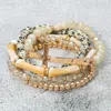 Fashnzfab 5pcs - Metal Cross Accent Resin Bamboo Bar Faceted Beaded Stretch Multi Layered Bracelets In Gold