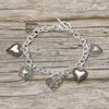 Fashnzfab Antique Metal Heart Charm Station Toggle Bracelet In Silver