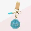 Fashnzfab Bling Stop Message Tassel Keychain In Blue