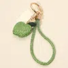 Fashnzfab Bling Studded Apple Charm Keychain Bag Charm Phone Holder In Green