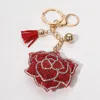 Fashnzfab Bling Studded Flower Tassel Keychain In Red