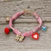 Fashnzfab Boho Playful Heart Bow Charm Station Fabric Bracelet Pink In Pink