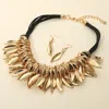 Fashnzfab Bold Metal Leaf Charm Embellished Chunky Statement Necklace In Gold