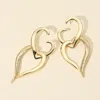 Fashnzfab Bold Sculptural Metal Heart Dangle Earrings In Gold