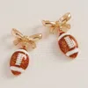 Fashnzfab Bow Accent Football Dangle Earrings - Brown, Gold In Multi