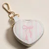 Fashnzfab Bow Accent Striped Printed Heart Shaped Jewelry Case Keychain Bag Charm In Pink
