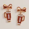 Fashnzfab Bow Football Themed Tumbler Dangle Earrings - Brown In Brown