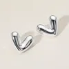 Fashnzfab Brass Metal Puffy Heart Earrings In White